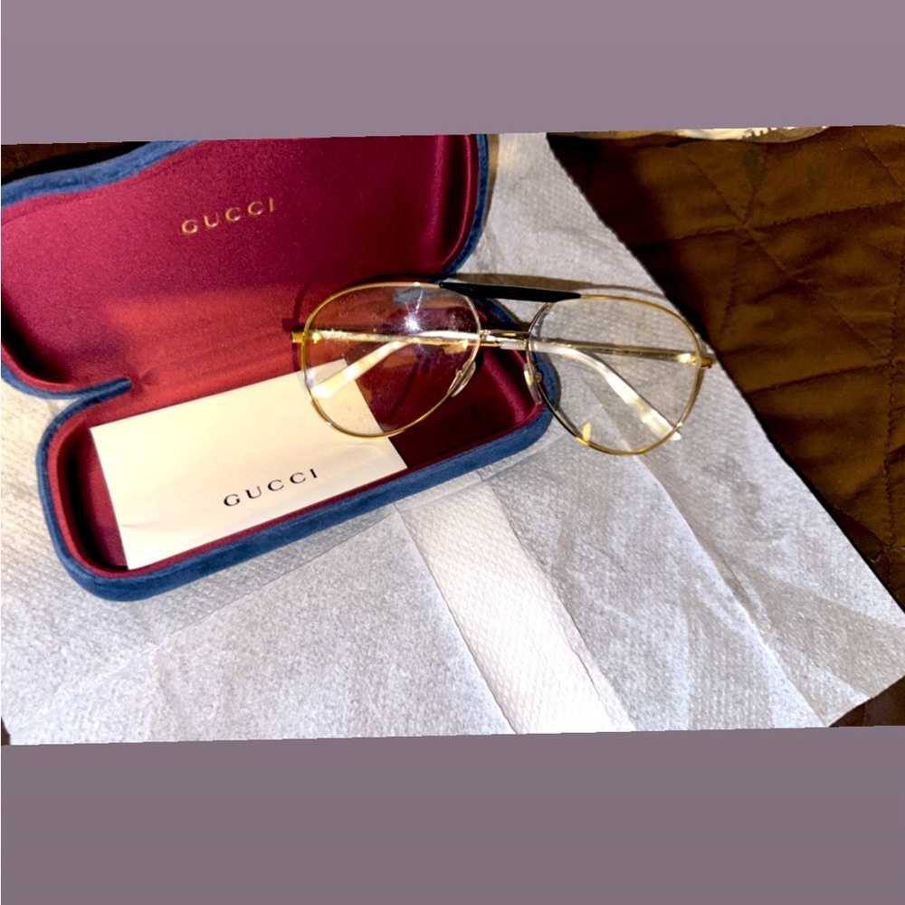 Gold frame with whitepearl ear coverings brand new pair never worn Gucci glasses